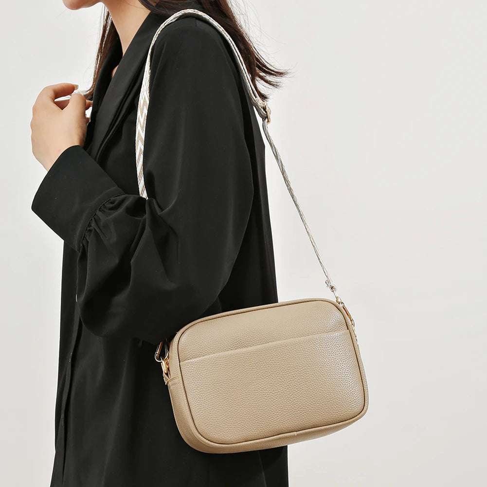 A modern women's handbag made of luxurious leather