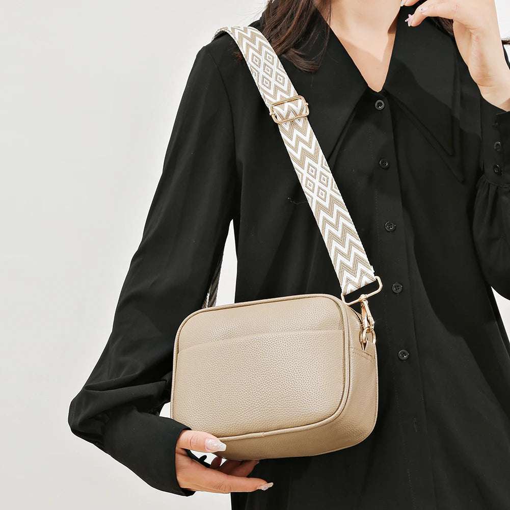 A modern women's handbag made of luxurious leather